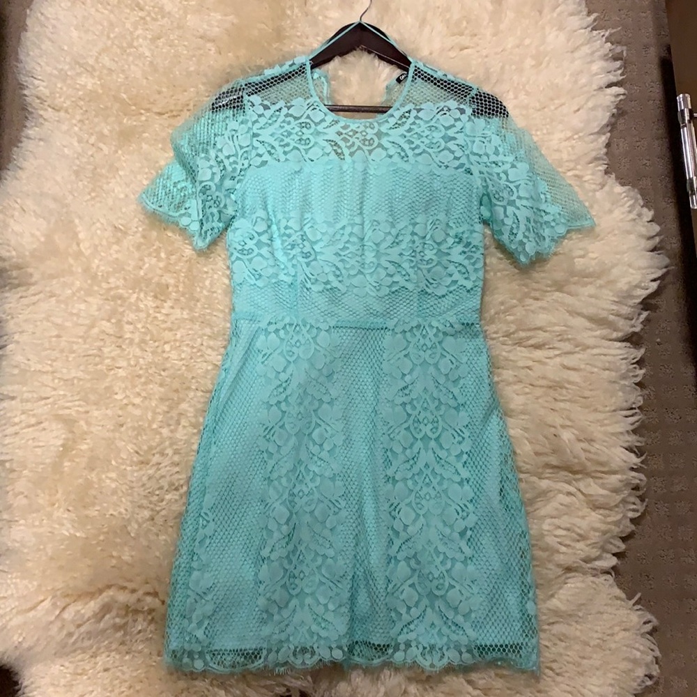 Sea foam lace dress with quarter sleeves.